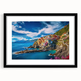 Colorful abstract art print of the Amalfi Coast in a black frame, ideal for living room decor.