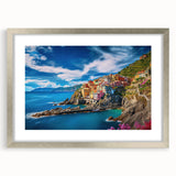 Extra large wall art depicting the Amalfi Coast in vibrant blue and white tones, framed with a silver mat.