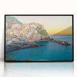 Framed acrylic print of a large abstract depiction of Cinque Terre with vibrant blue and green tones.