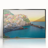 Framed acrylic print of Cinque Terre with pastel-colored buildings and sea, ideal for modern art wall decor.