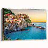 Framed canvas wall art depicting the vibrant, colorful landscape of Cinque Terre, Italy, ideal for bedroom decor.