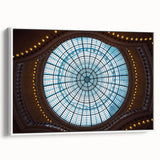 Vintage poster art of Amsterdam with colorful buildings on black framed canvas, ideal for living room decor.