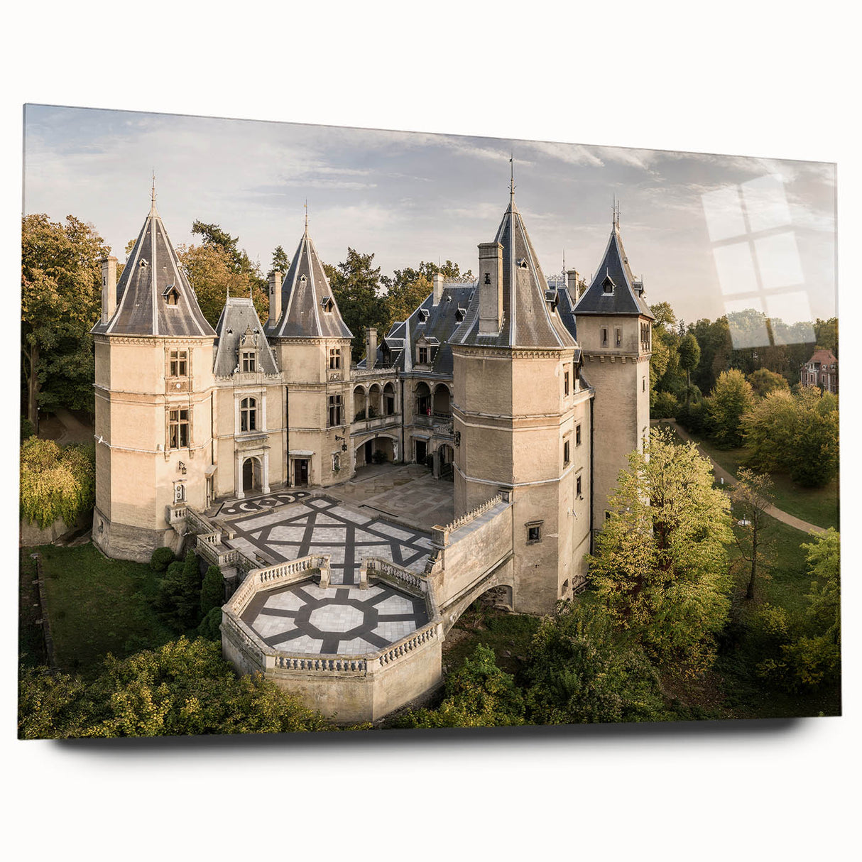 Large abstract wall art depicting a European scenery in muted earth tones on acrylic glass.