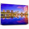 Large abstract wall art of a European cityscape in muted gray and blue tones on acrylic glass.