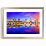Extra large abstract art print of a textured European cityscape in cool gray tones, framed in silver.