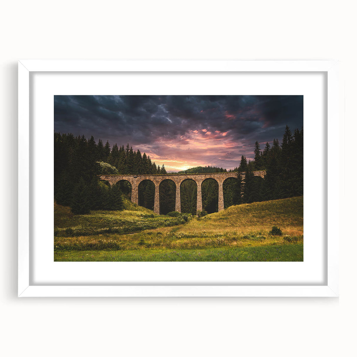 Textured abstract art print depicting a European scenery in muted earth tones, framed in white, suitable for bedroom decor.