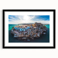 Abstract art print of Valencia scenery in vibrant colors on textured canvas, framed in black, ideal for living room decor.