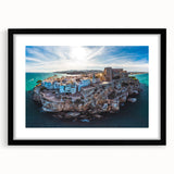 Abstract art print of Valencia scenery in vibrant colors on textured canvas, framed in black, ideal for living room decor.