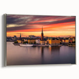 Framed canvas landscape art painting of Stockholm featuring colorful buildings and water, set in a silver frame.