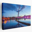 Side view of a stretched canvas featuring a serene Welsh landscape in earthy green and blue tones.