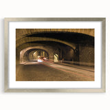 Textured art print of Guanajuato, Mexico, featuring abstract multicolored patterns, displayed in a silver frame.