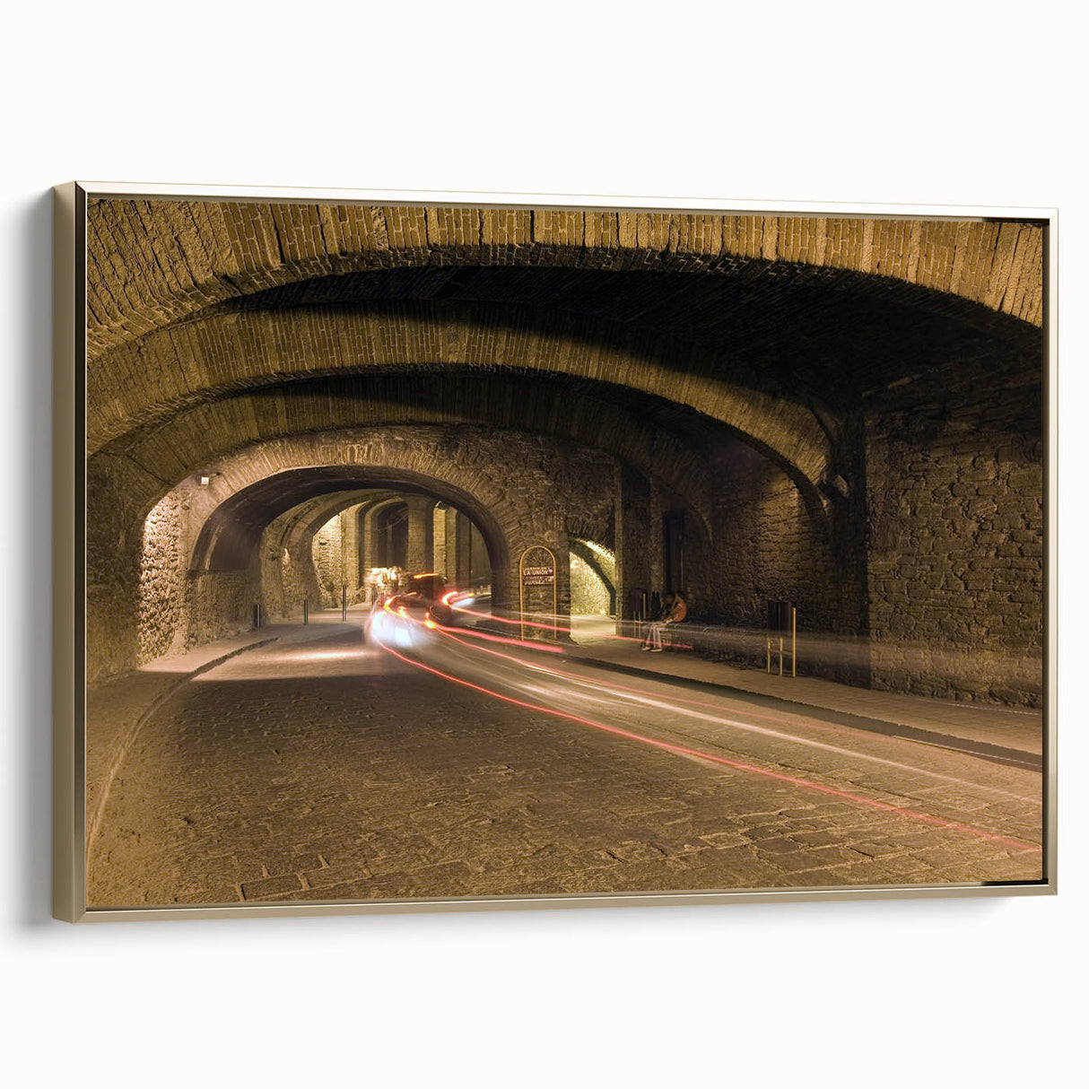 Framed canvas of a vintage-style landscape painting depicting Guanajuato, Mexico, in muted gold and black tones.