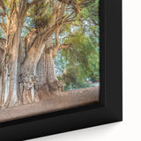 Black wall art depicting a textured scene of Oaxaca with vibrant, colorful details on a large framed canvas.