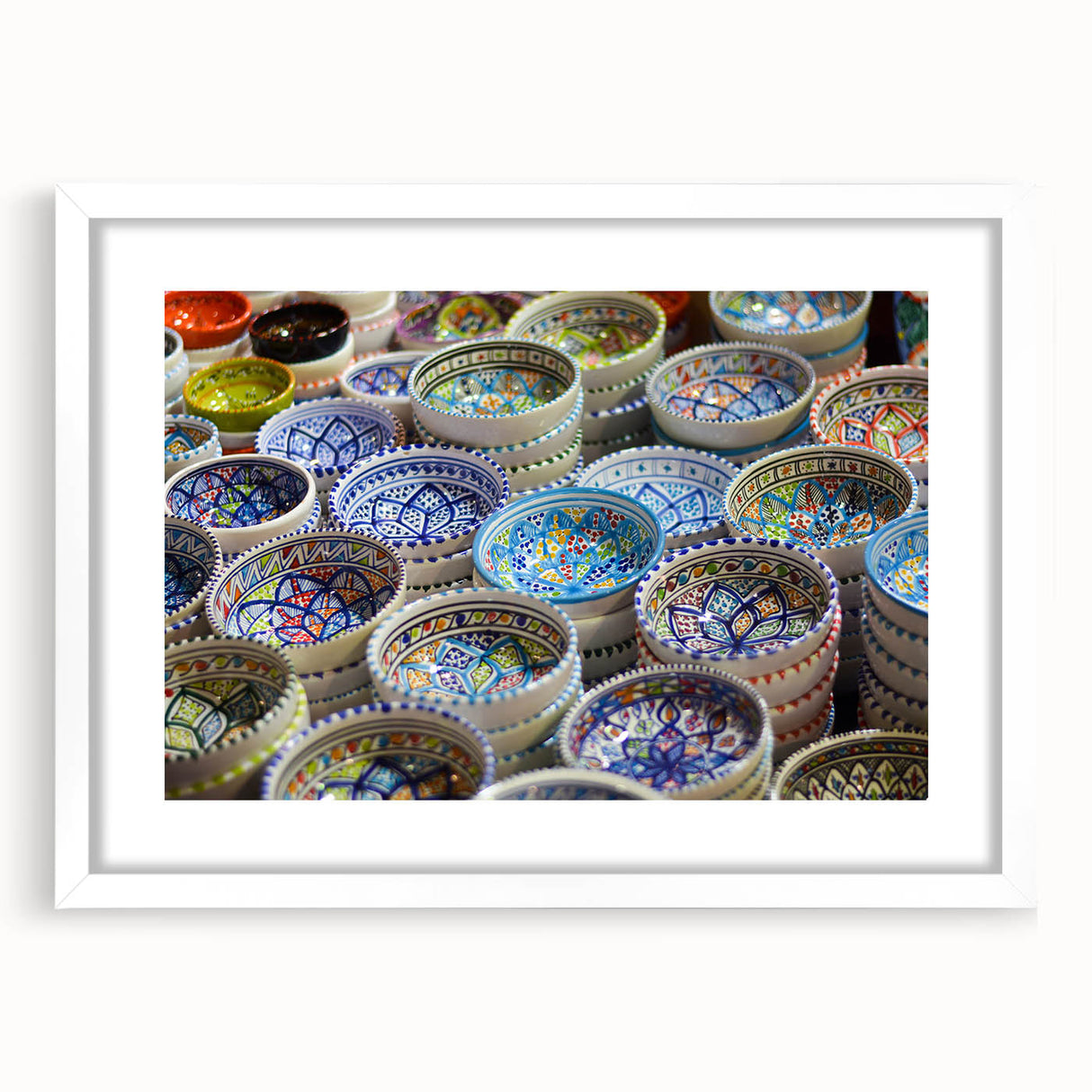 Abstract art print of Jerusalem skyline in muted earth tones on a framed white mat, suitable for dining room decor.