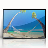 Large abstract wall art featuring a Fiji oceanscape in blue and teal hues, framed in black acrylic.