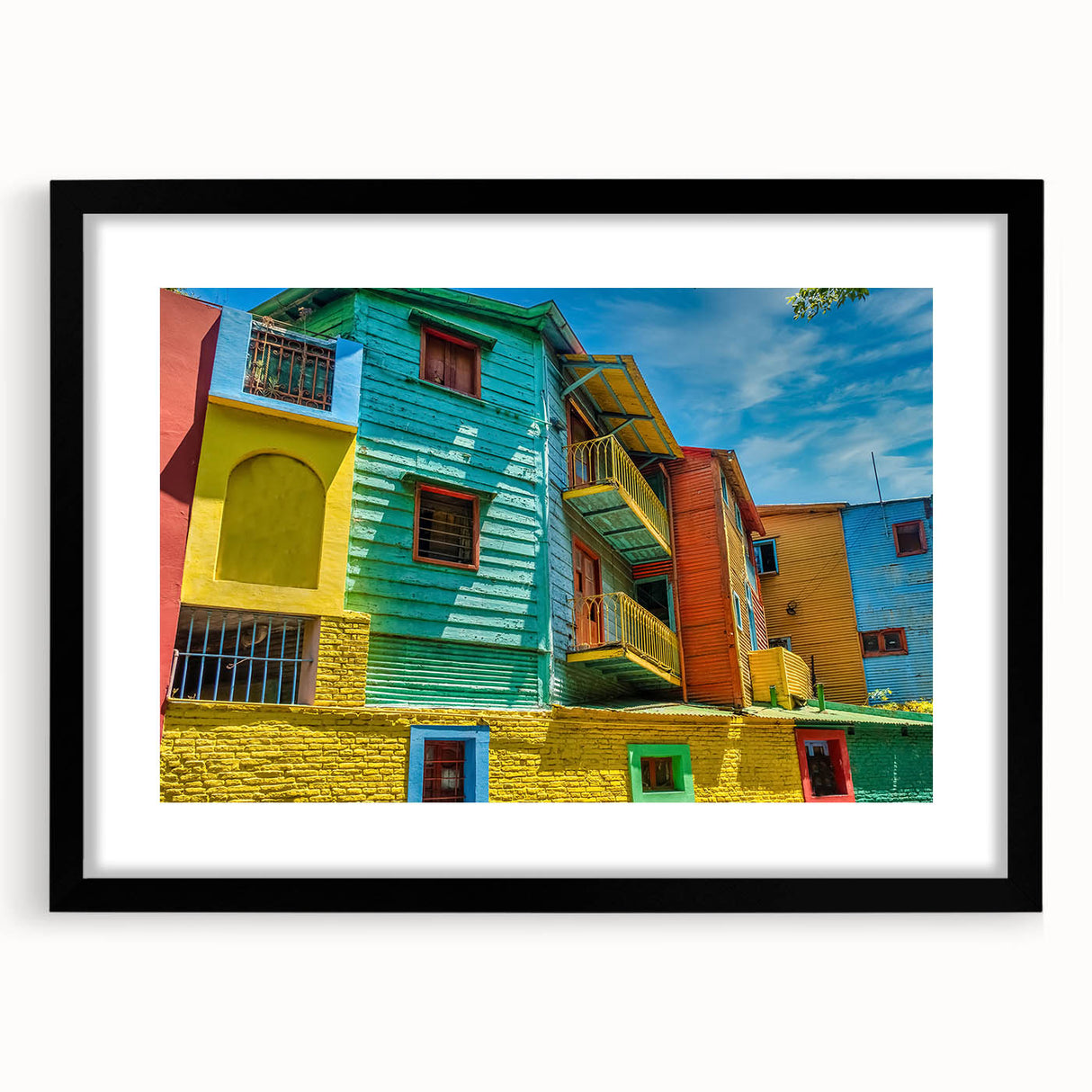 Extra large abstract art print featuring a colorful, textured depiction of a South American scenery, framed in black.
