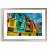 Textured abstract art print depicting a stylized Buenos Aires cityscape in muted earth tones on a framed silver mat.