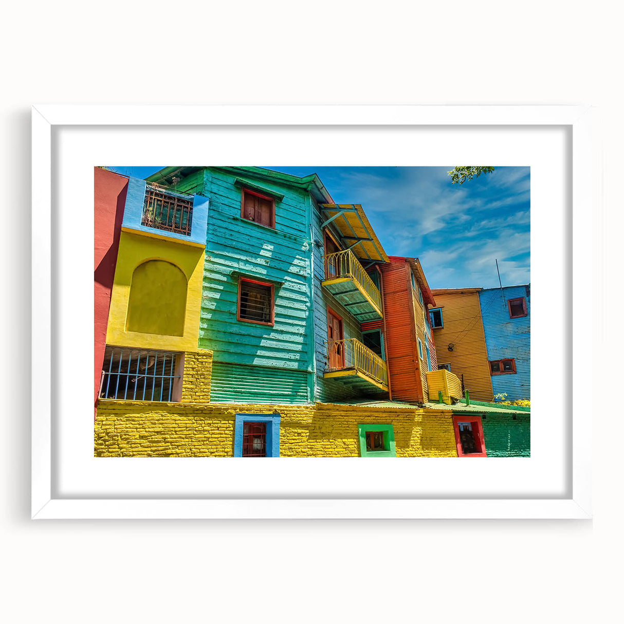 Abstract art print of Buenos Aires in soft blue and pink tones on a framed white mat, ideal for dining room decor.