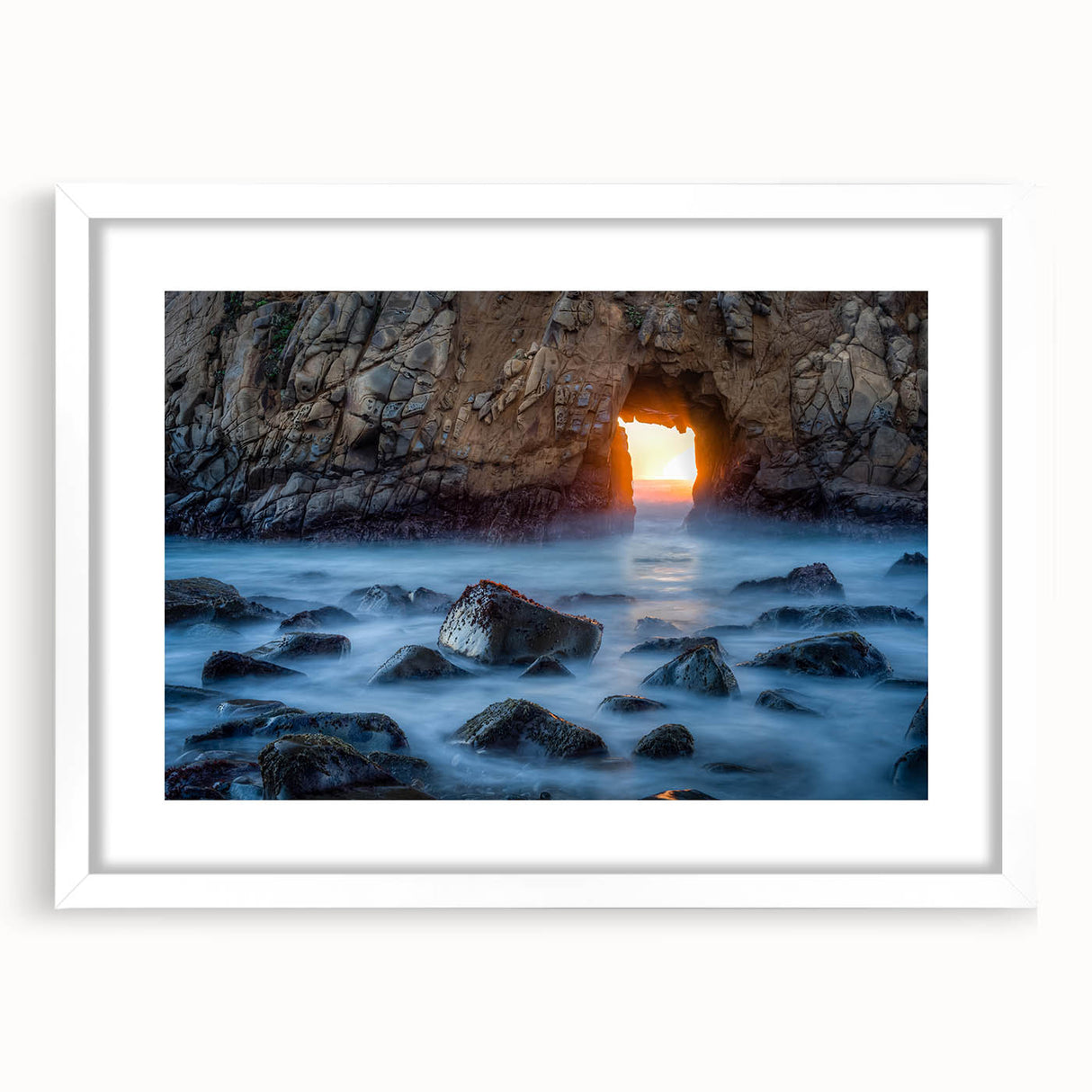 Abstract art print of Big Sur, California in muted earth tones on a framed white mat, suitable for dining room decor.