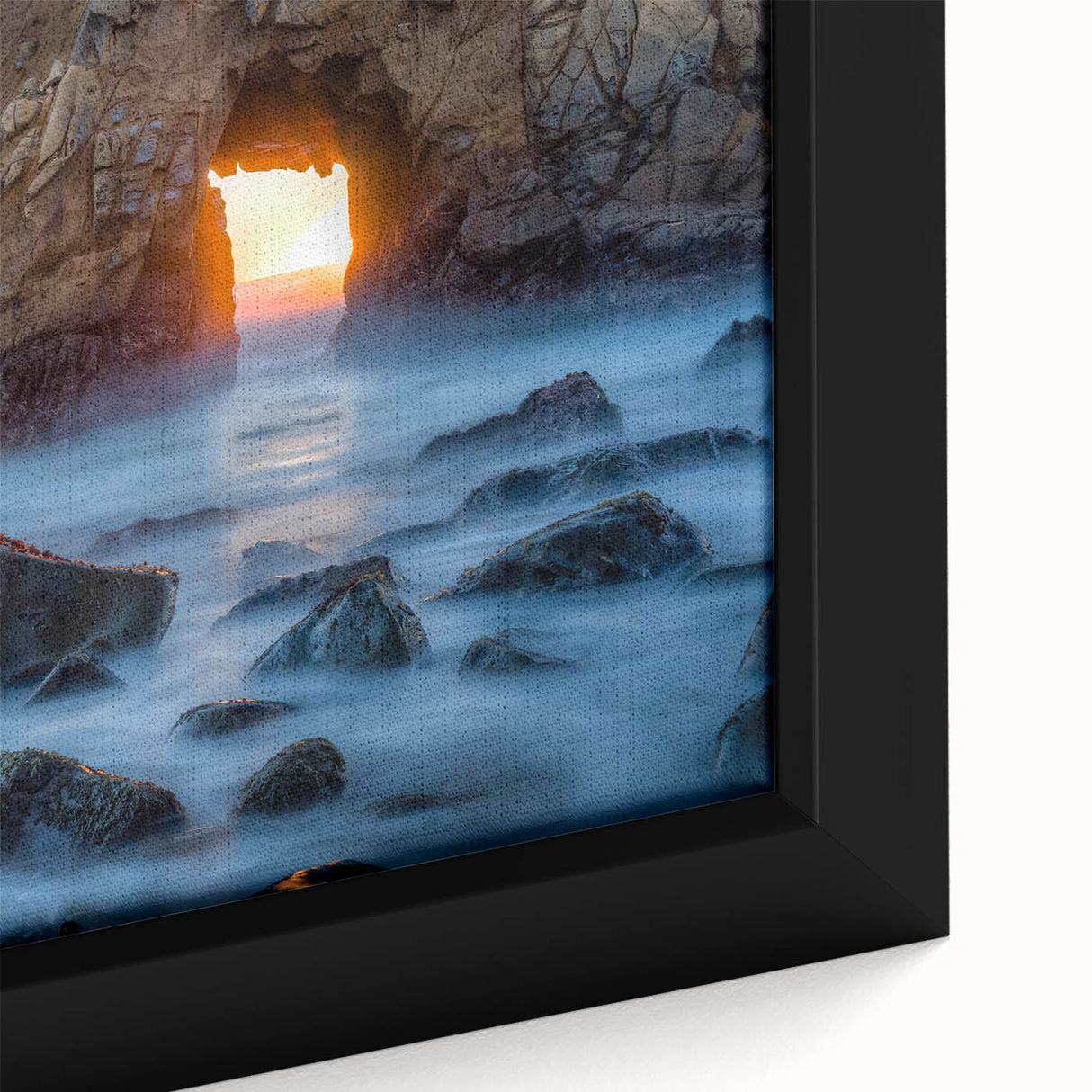 Close-up of a textured, extra-large framed canvas depicting California's Big Sur in black with colorful accents.