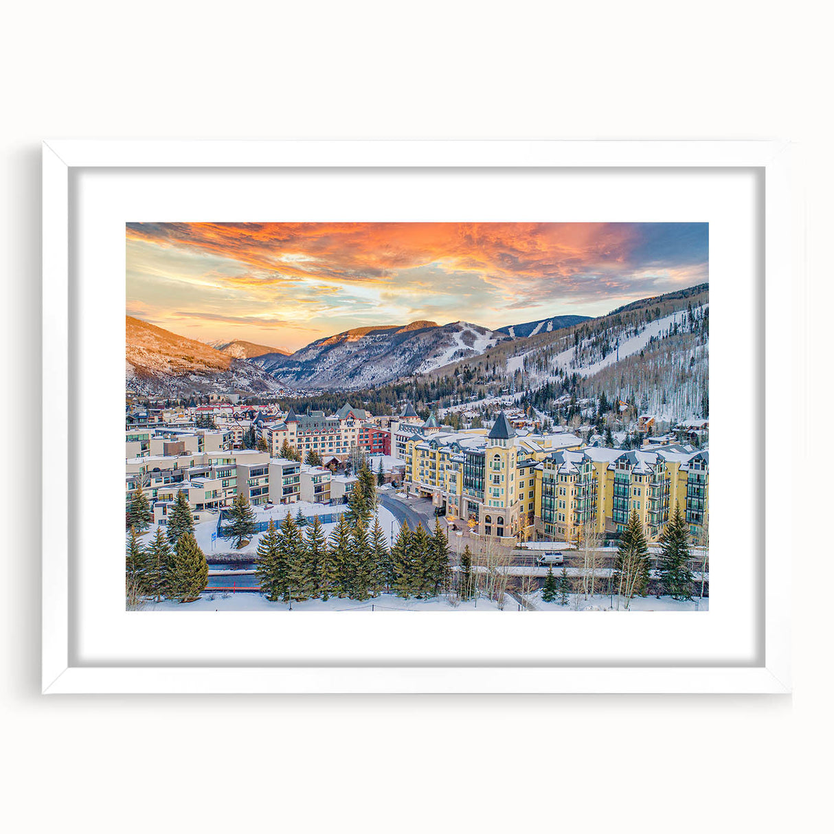 Abstract art print of Vail, Colorado in muted earth tones on a framed white mat, suitable for dining room decor.