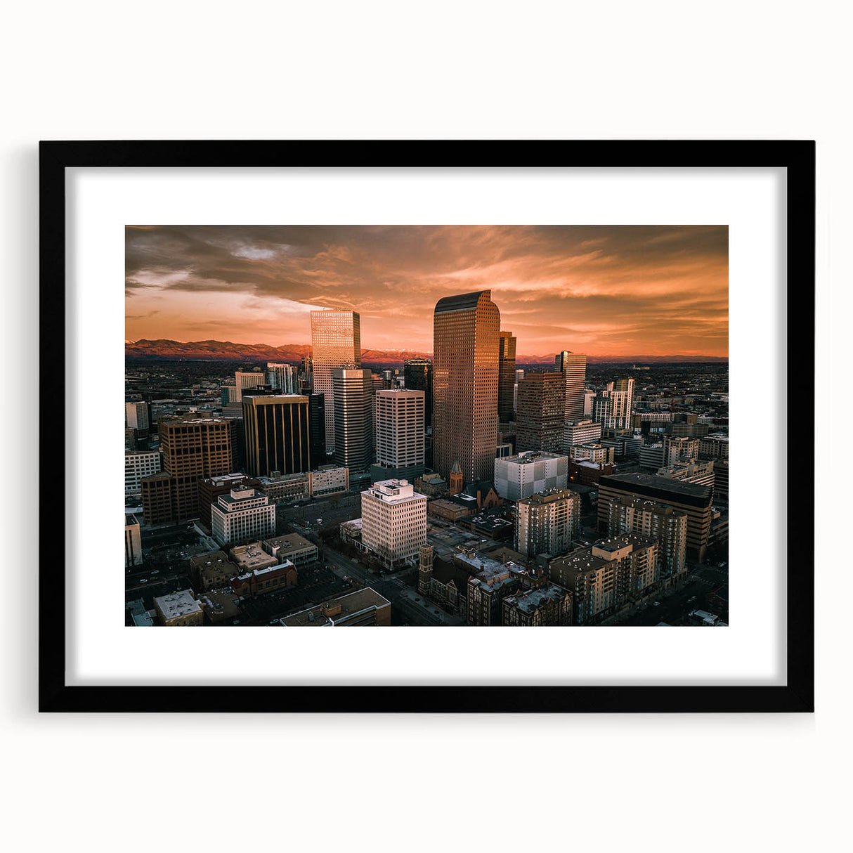 Abstract art print of Denver skyline in colorful, textured style on a large framed canvas, suitable for living room decor.