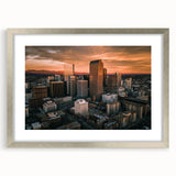 Textured abstract art print of Denver skyline in muted gray and silver tones, framed with a mat.