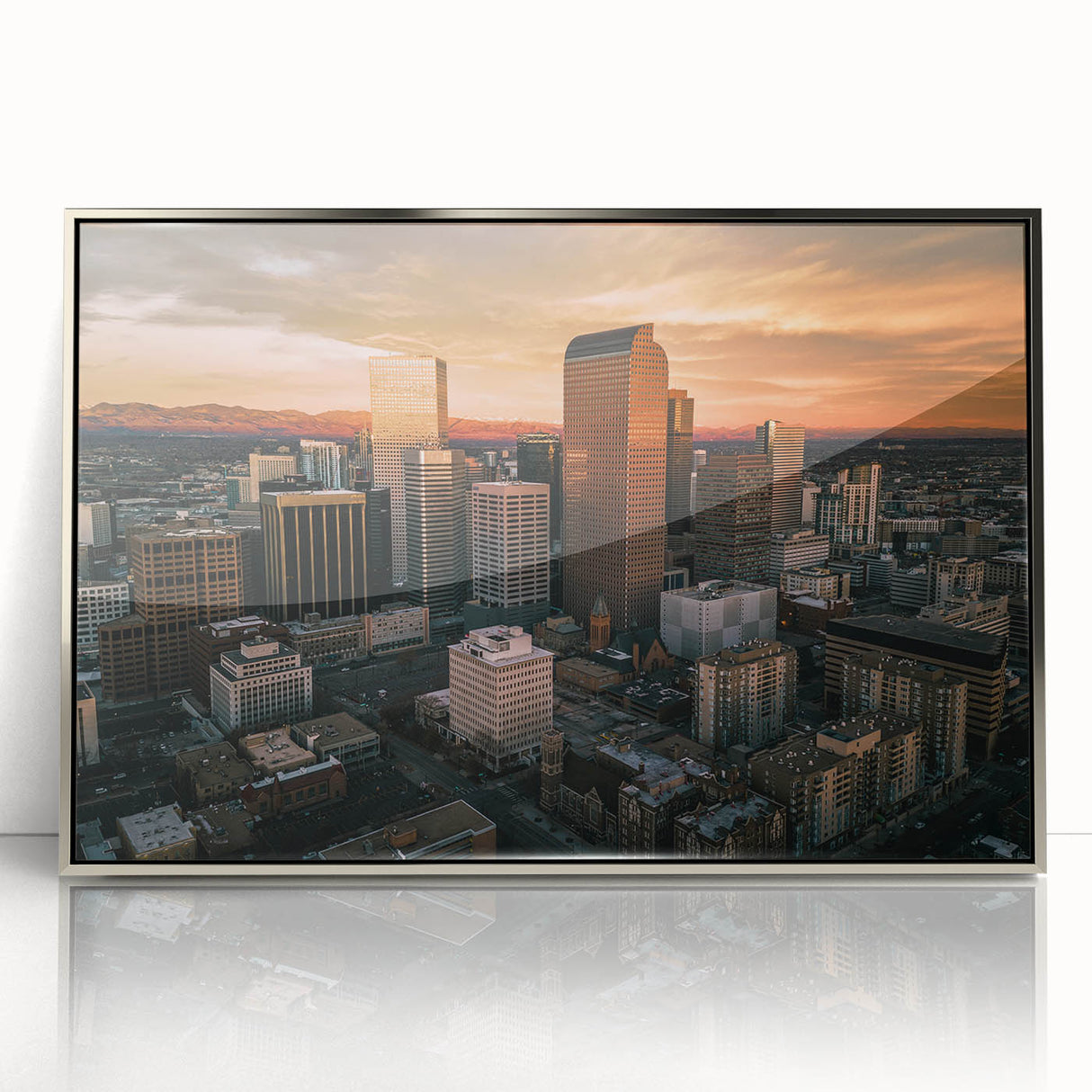 Mid-century modernist art depicting the Denver skyline in muted orange and blue tones, framed acrylic print.