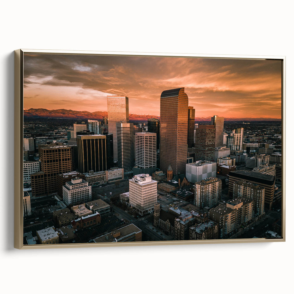Framed canvas wall art featuring a vintage-style landscape painting of Denver, Colorado in black and gold tones.