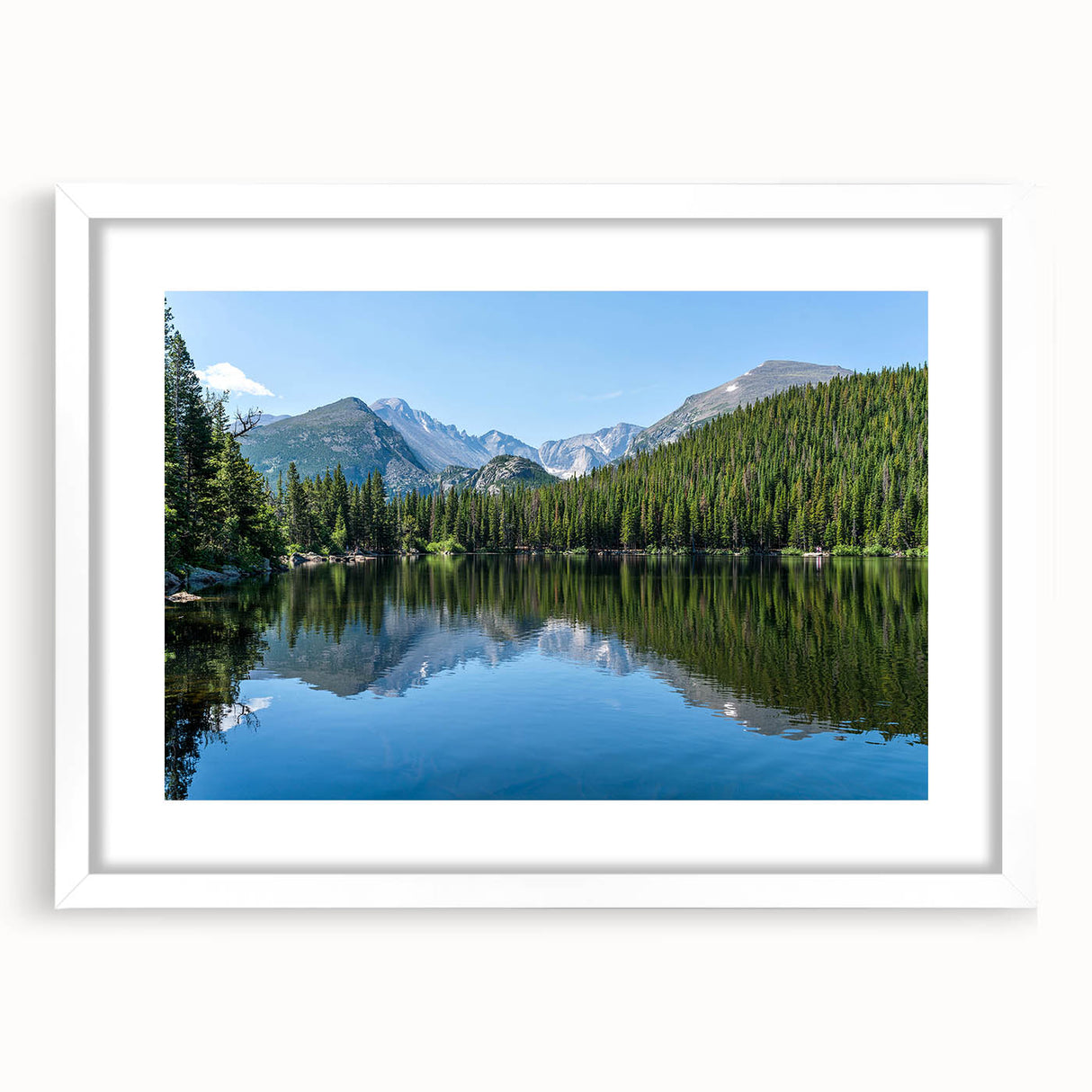 Abstract art print depicting Colorado Springs scenery in muted earth tones on a framed white mat.