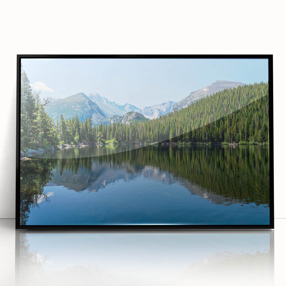 Large abstract wall art depicting Colorado Springs scenery in muted earth tones on a black framed acrylic print.