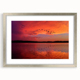 Textured art print of abstract Lake Michigan, featuring muted blue and gray tones on a framed silver mat.