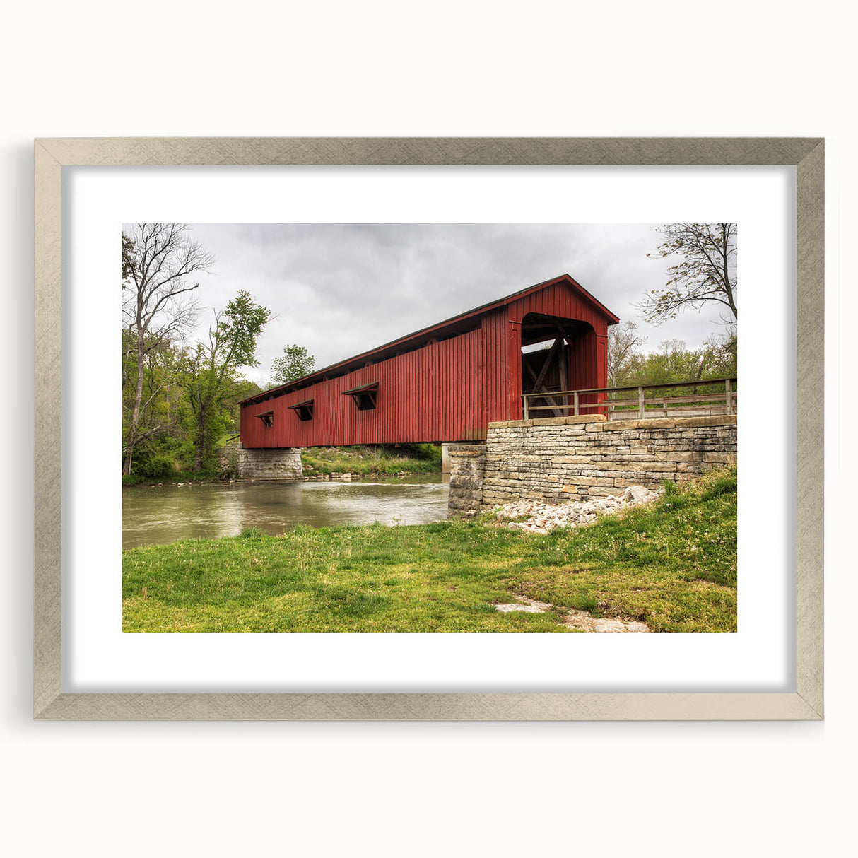 Textured abstract art print of Indiana scenery in muted earth tones, framed with a silver mat, suitable for bedroom decor.