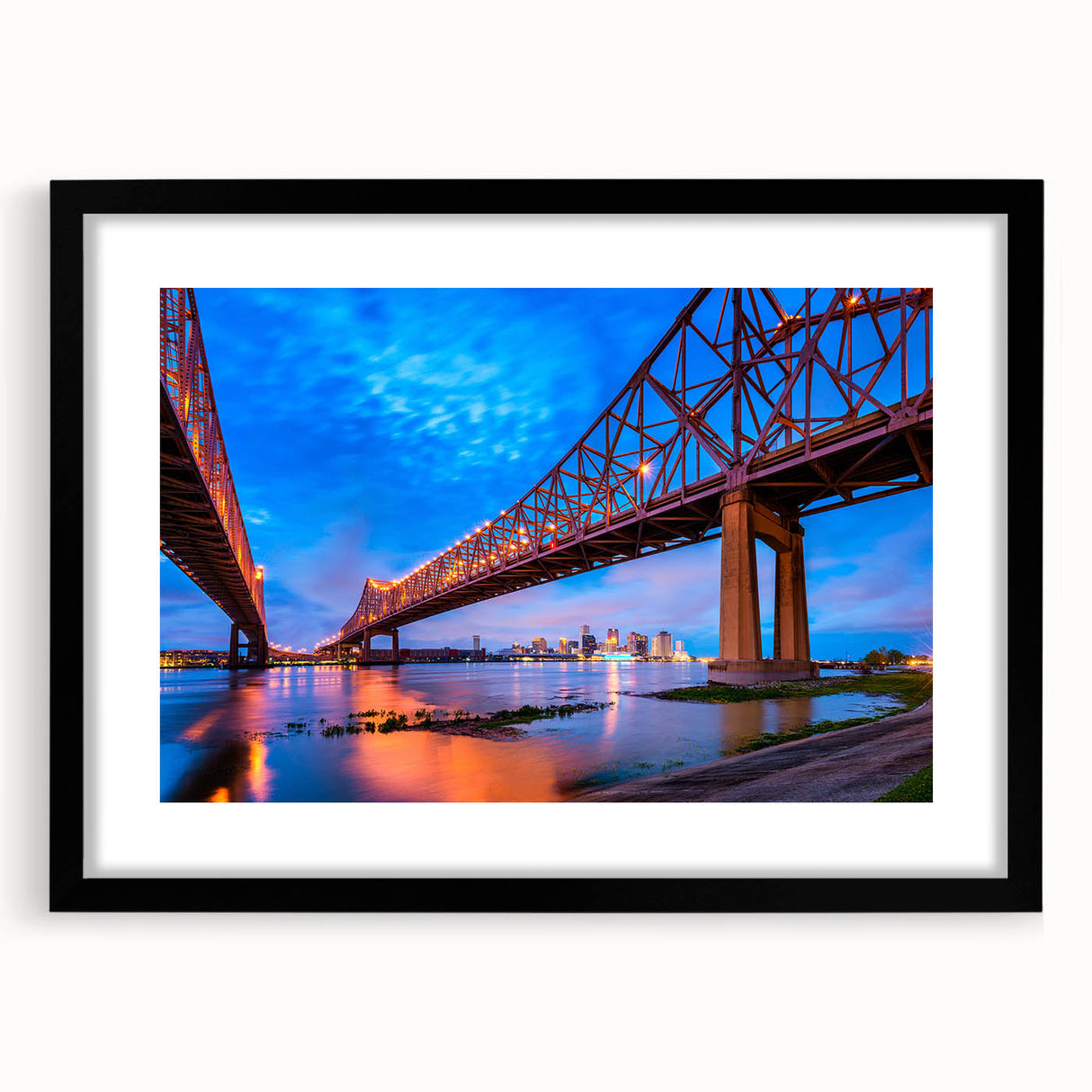 Colorful abstract art print of a textured New Orleans scene in vibrant hues, framed in black, ideal for living room decor.
