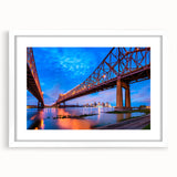 Abstract art print of New Orleans scenery in muted green and blue tones on a framed white mat, ideal for dining room decor.
