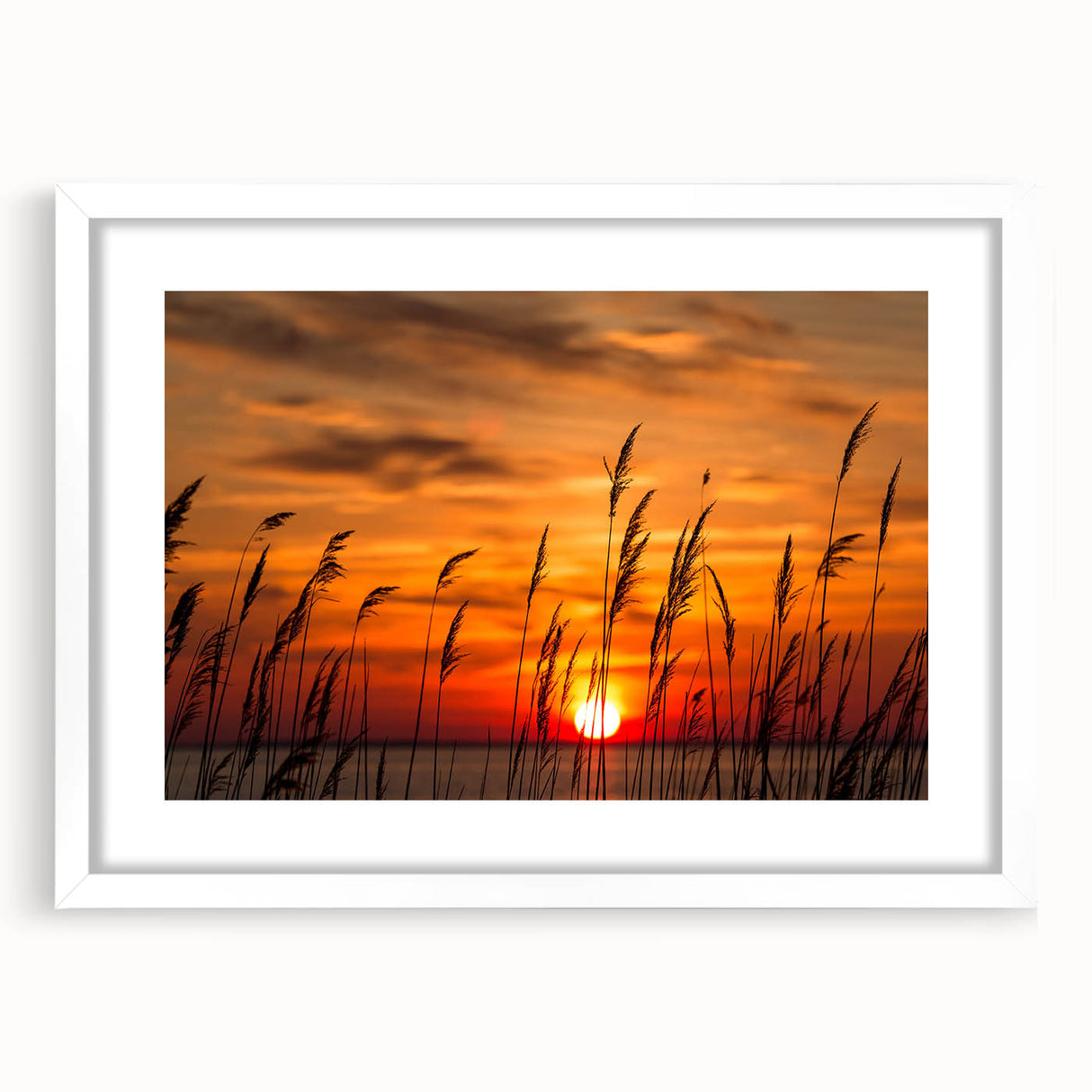 Abstract art print of Chesapeake Bay in muted blue and green tones, framed with a white mat, suitable for dining room decor.