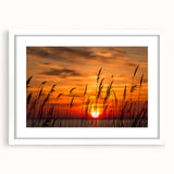 Abstract art print of Chesapeake Bay in muted blue and green tones, framed with a white mat, suitable for dining room decor.