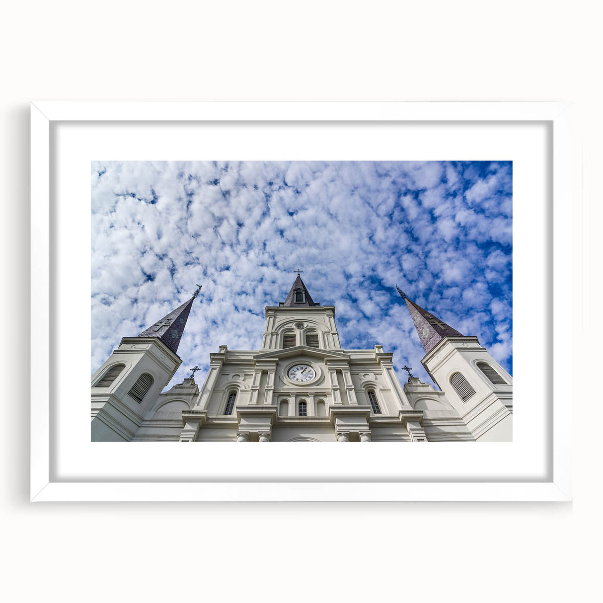 Abstract art print of St. Louis skyline in muted blue and gray tones on a framed white mat, suitable for dining room decor.