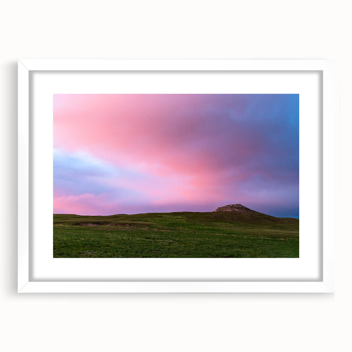 Abstract art print of Nebraska scenery in muted earth tones, framed with a white mat, ideal for dining room decor.