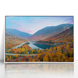 Acrylic print of a serene New Hampshire landscape in muted green and blue tones, framed in white.