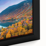 Close-up of a black framed canvas depicting a textured, colorful New Hampshire scenery, ideal for living room decor.