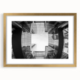 Extra large abstract art print of Charlotte skyline in muted gray and gold tones, framed with a mat.
