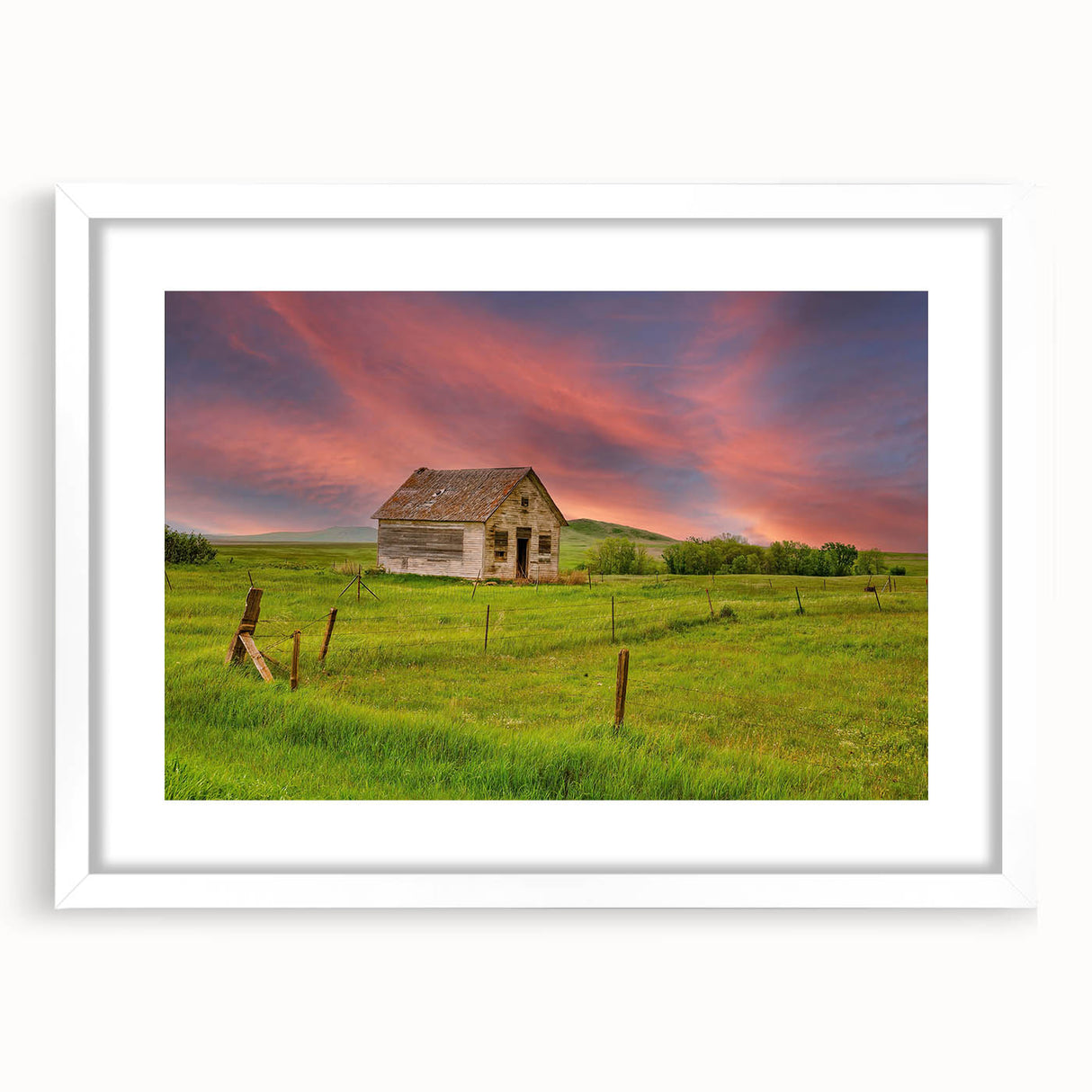 Abstract art print of North Dakota scenery in muted earth tones on a white-framed mat, ideal for dining room decor.