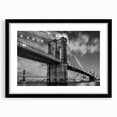 Colorful art print of an abstract Brooklyn Bridge in vibrant hues on a large textured canvas, ideal for living room decor.