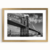 Extra large wall art featuring an abstract print of the Brooklyn Bridge in muted gray and gold tones on a framed canvas.