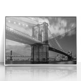 Acrylic print of the Brooklyn Bridge in muted grays and whites, framed in white, suitable as modern art wall decor.