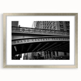 Textured abstract art print of NYC's Grand Central in muted gray tones, framed in silver, ideal for bedroom art.