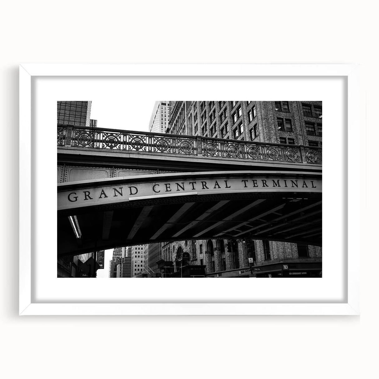 Abstract art print of NYC's Grand Central in muted gray and blue tones, framed with a white mat, ideal for dining room decor.