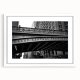 Abstract art print of NYC's Grand Central in muted gray and blue tones, framed with a white mat, ideal for dining room decor.