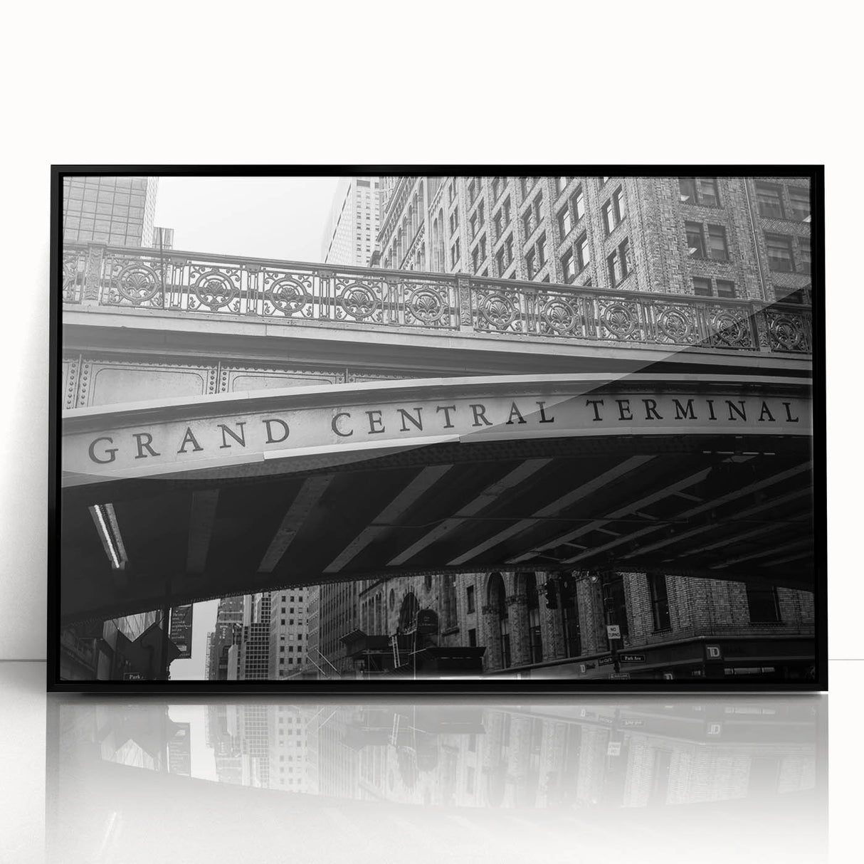 Framed acrylic print of a large abstract depiction of NYC's Grand Central, in black and gray tones.
